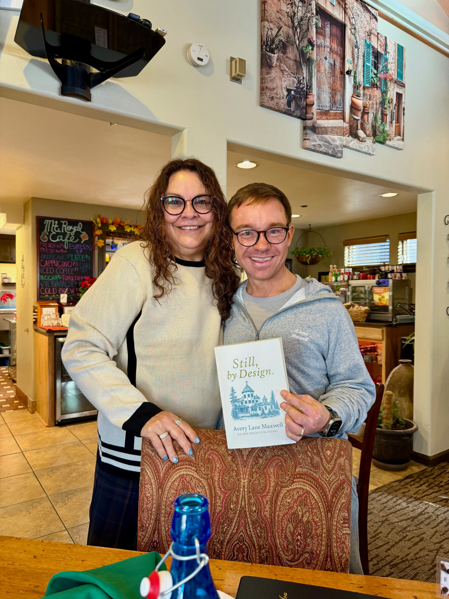 Author and guest holding Still, by Design.