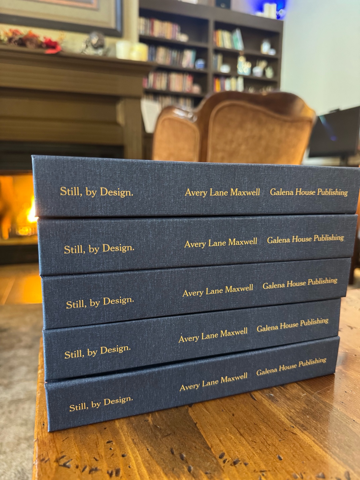 Stack of Still, by Design hardcovers in Plato’s Corner at the Frisco Inn on Galena