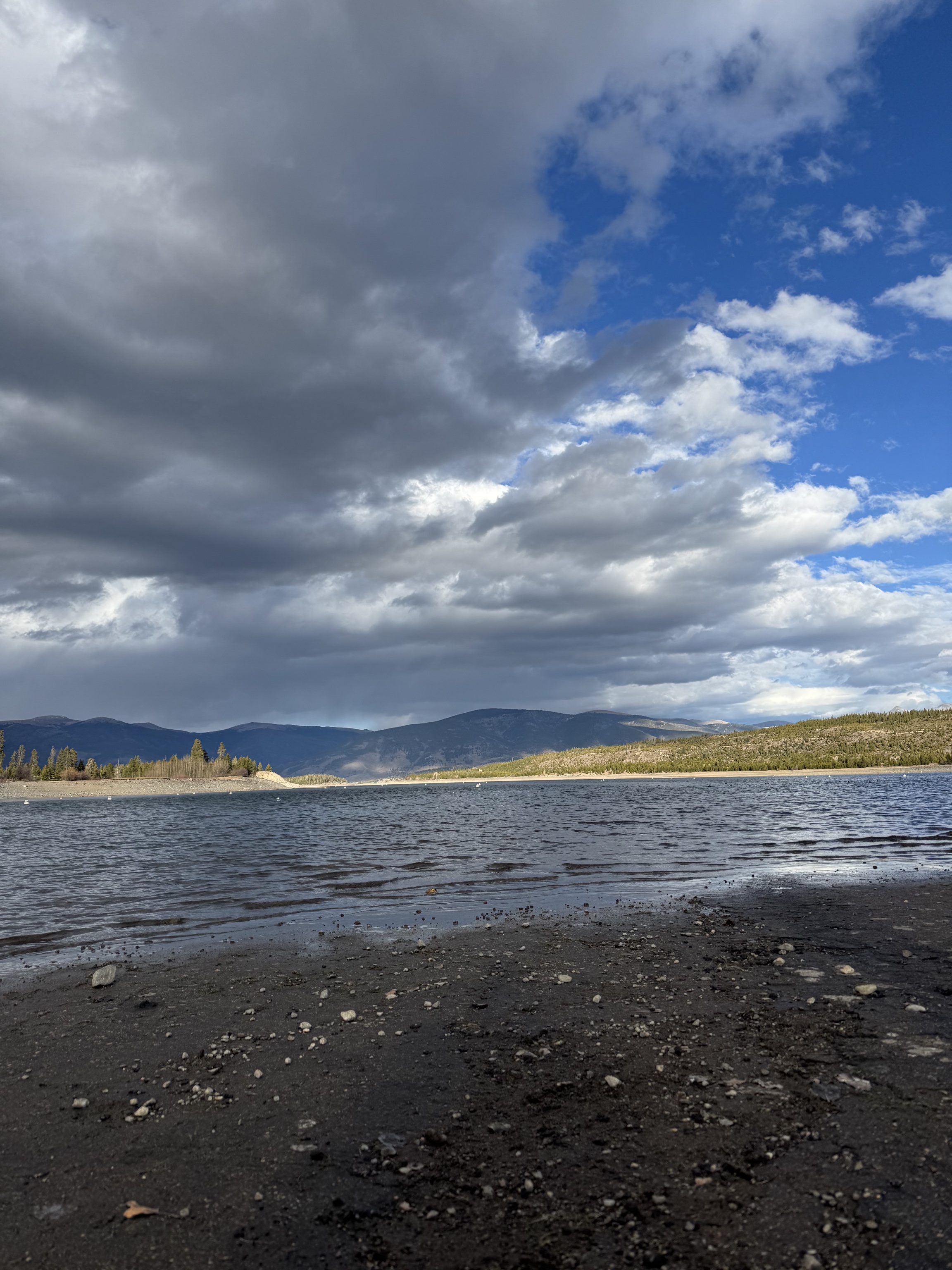 Lake Dillon marina with mountain clouds