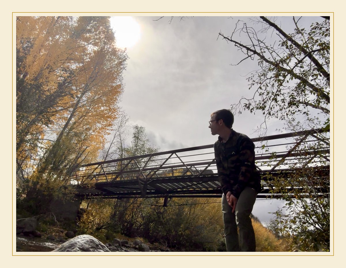 Avery on a footbridge over the creek in October