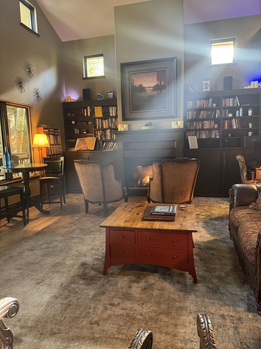 Still, by Design. — signed paperback in the inn's reading corner
