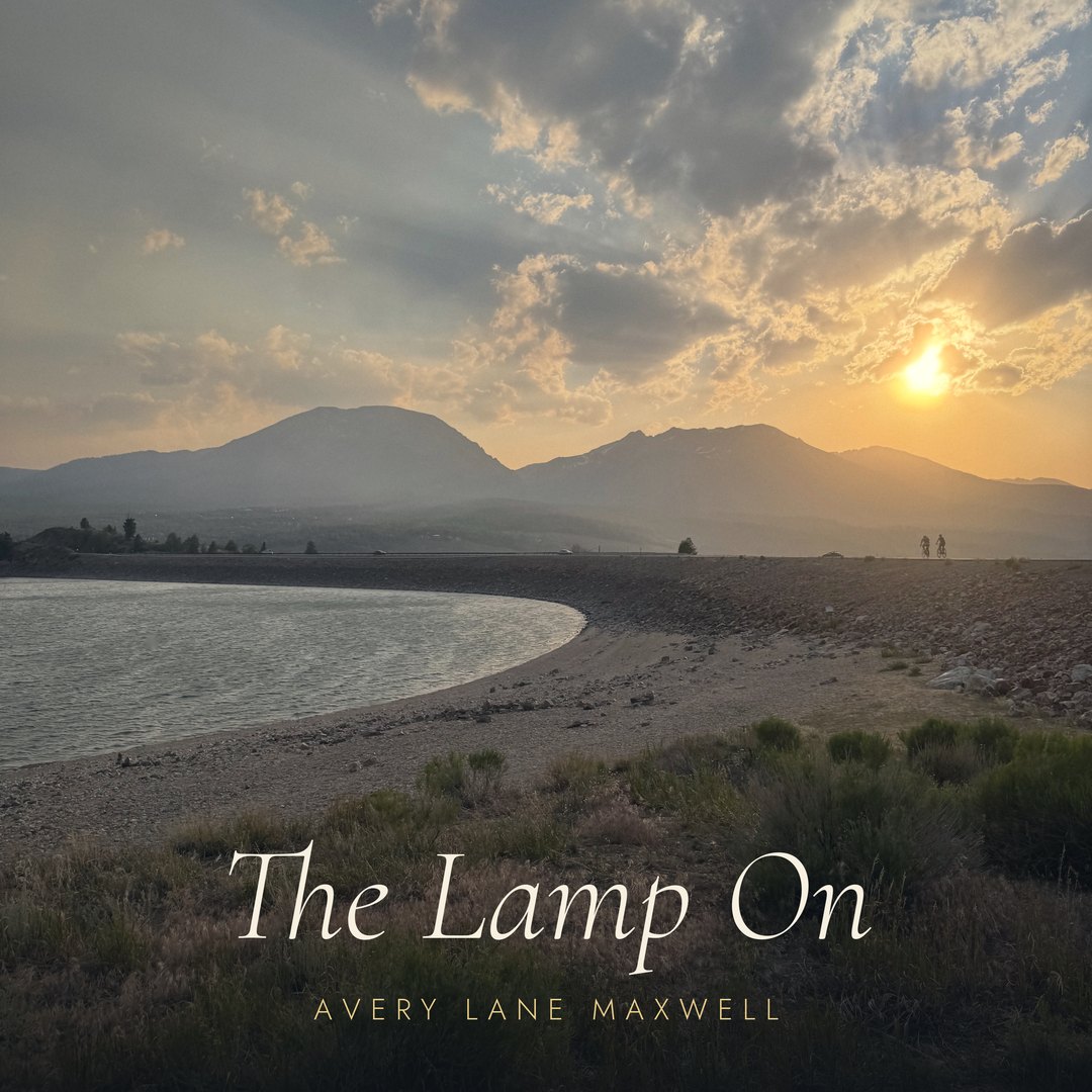 The cover of The Lamp On: Lake Dillon at sundown.
